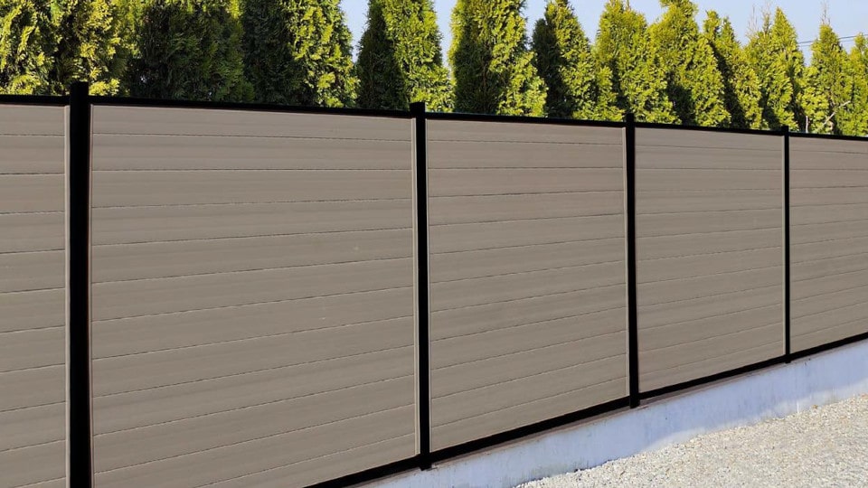 modern full privacy horizontal vinyl fence in adobe with black aluminum posts and rails and tongue and groove pickets