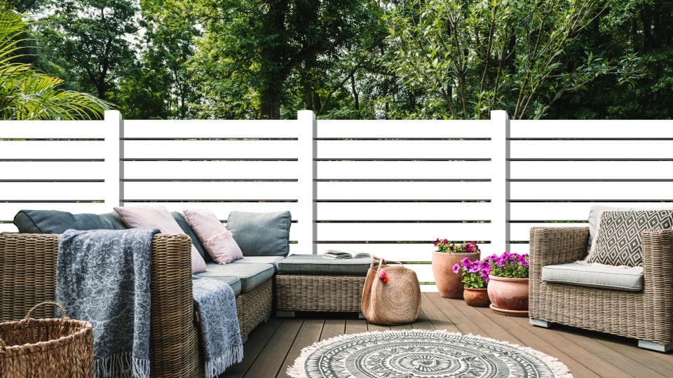 modern semi privacy horizontal vinyl fence in white with 6 inch pickets